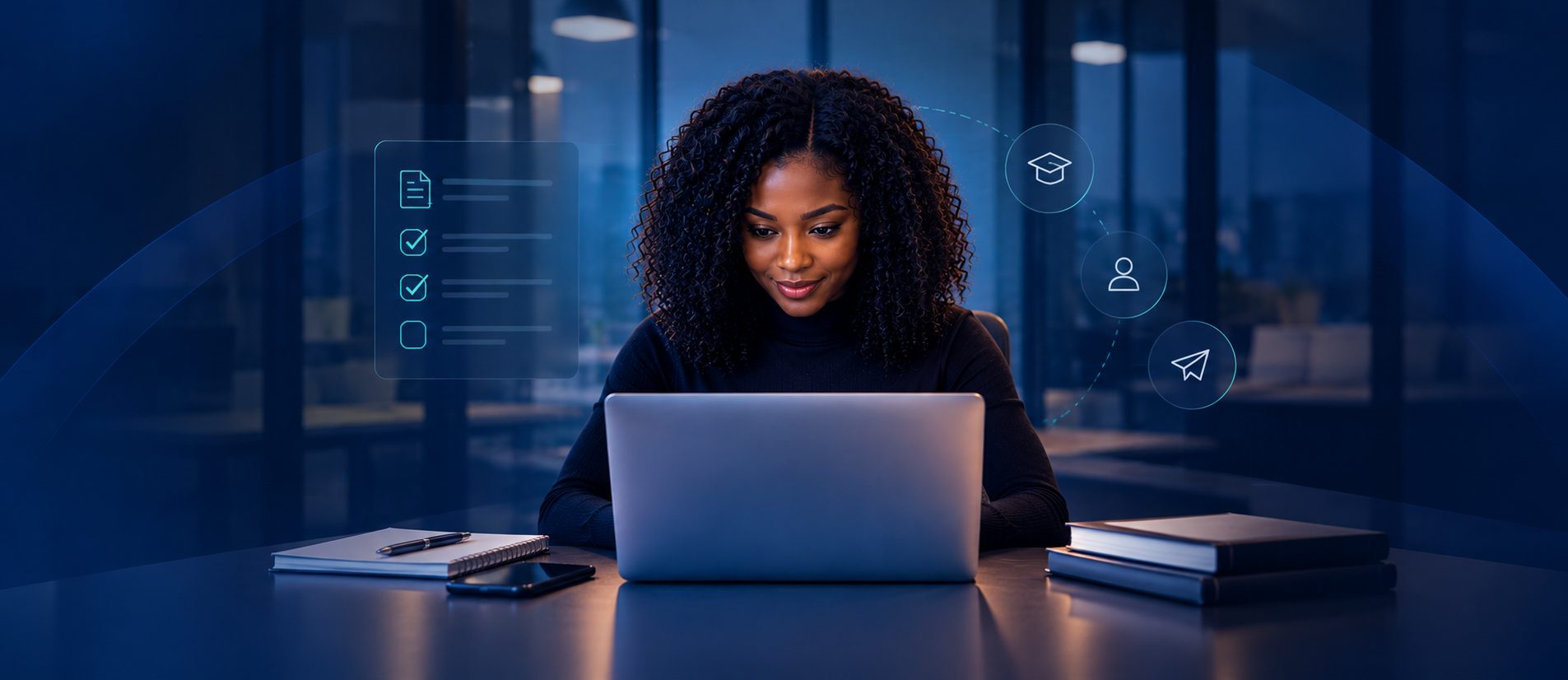 A young woman working through her application on a laptop at night